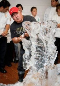 Cook Clifford Goto gives an ice carving demonstration to University of Hawaii Center at West Hawaii culinary students on Wednesday at the Mauna Lani Bay Hotel & Bungalows, using specialized tools to chip away at the ice. (Anna Pacheco/Special to West Hawaii Today)